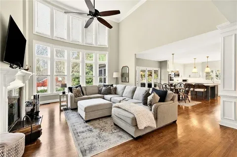a living room with fireplace furniture and a flat screen tv