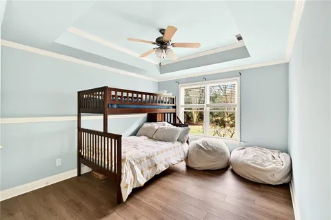 a bedroom with furniture and a window