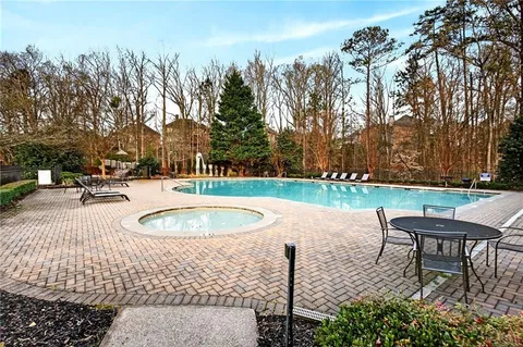 a view of a swimming pool with a patio