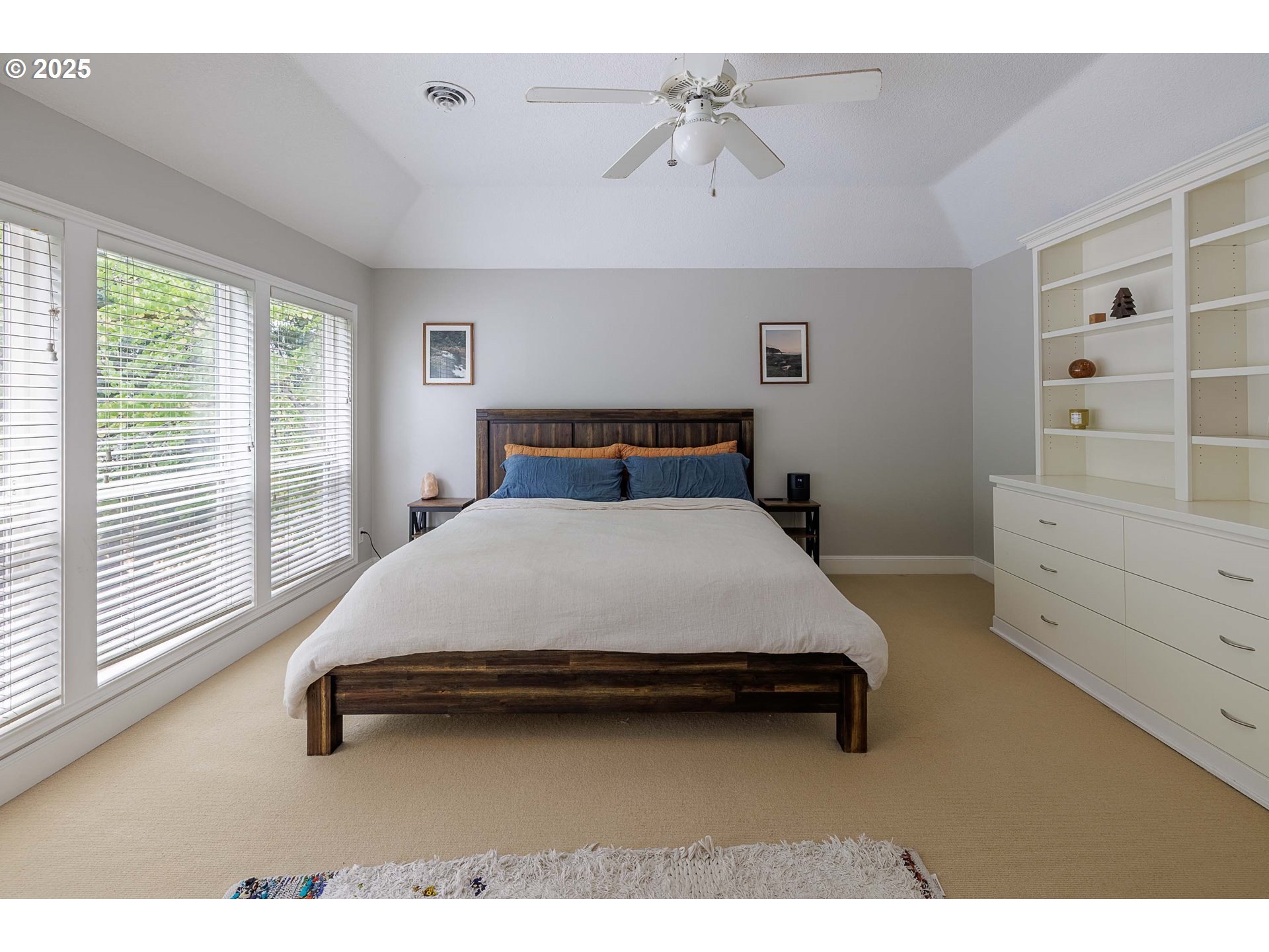 6424 Southwest Flower Street Portland, OR 97221 - Photo 11 of 29 a bedroom with a bed and a window