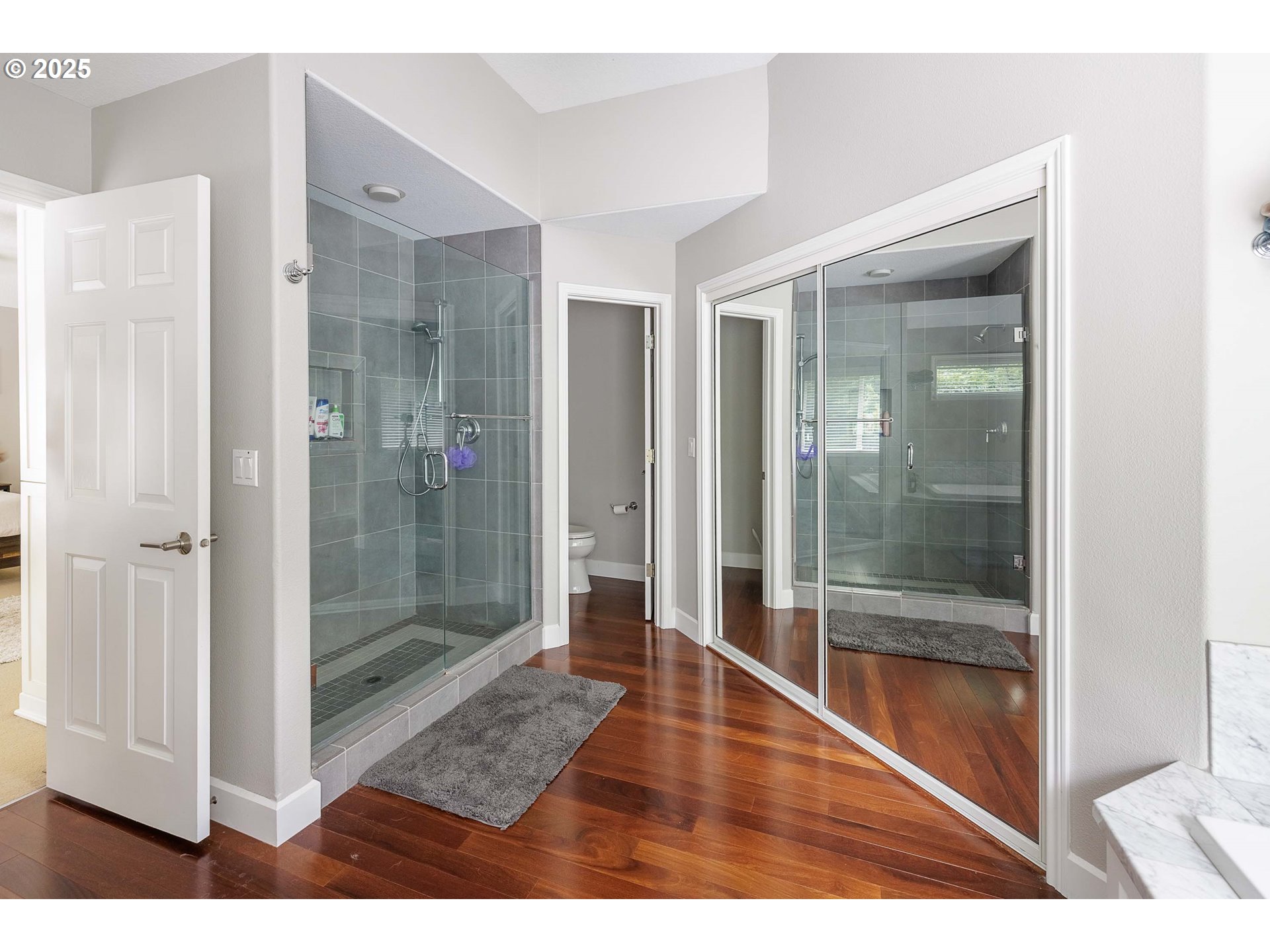 6424 Southwest Flower Street Portland, OR 97221 - Photo 15 of 29 a bathroom with a glass shower door