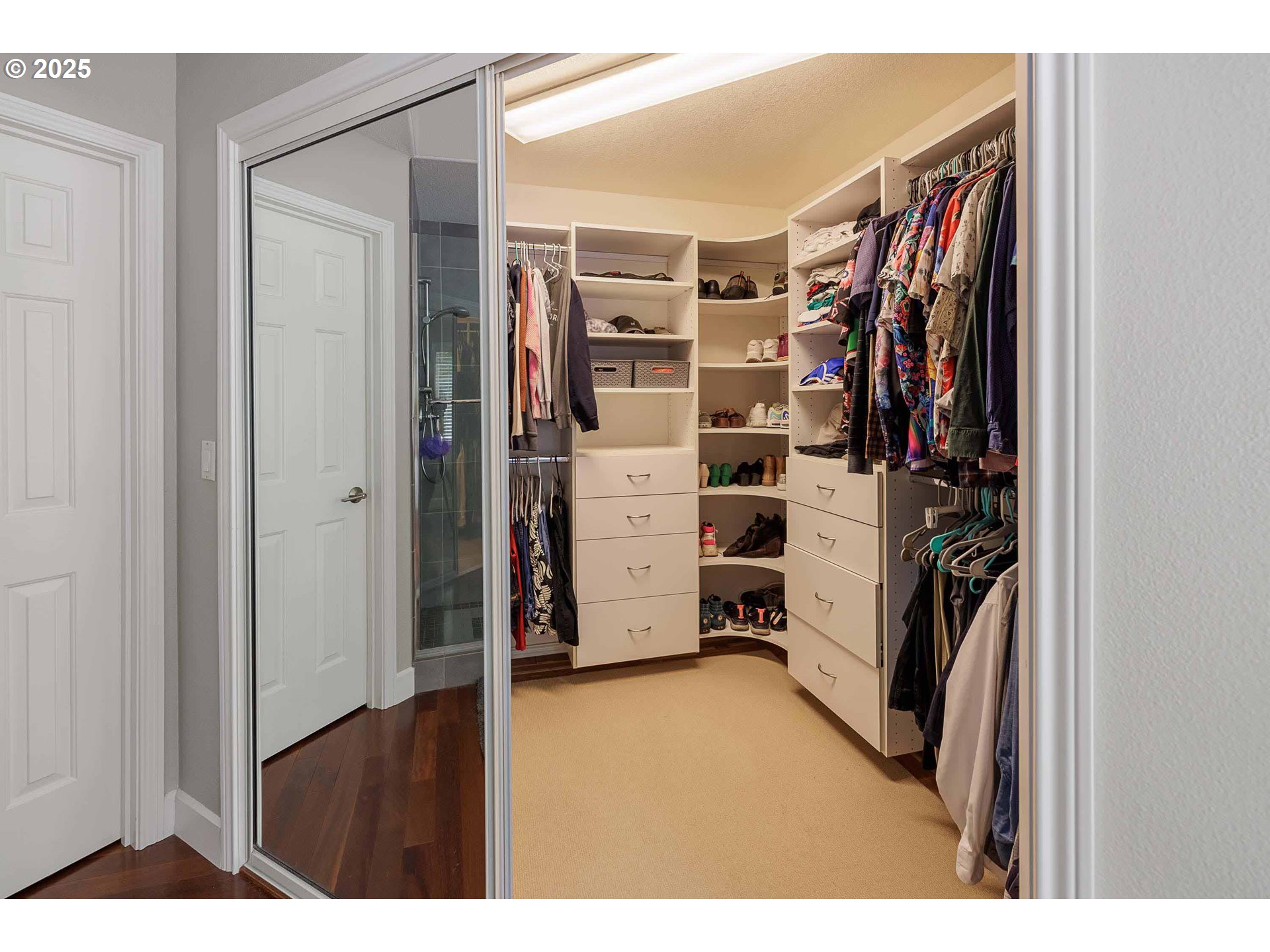 6424 Southwest Flower Street Portland, OR 97221 - Photo 16 of 29 a view of walk in closet with clothes