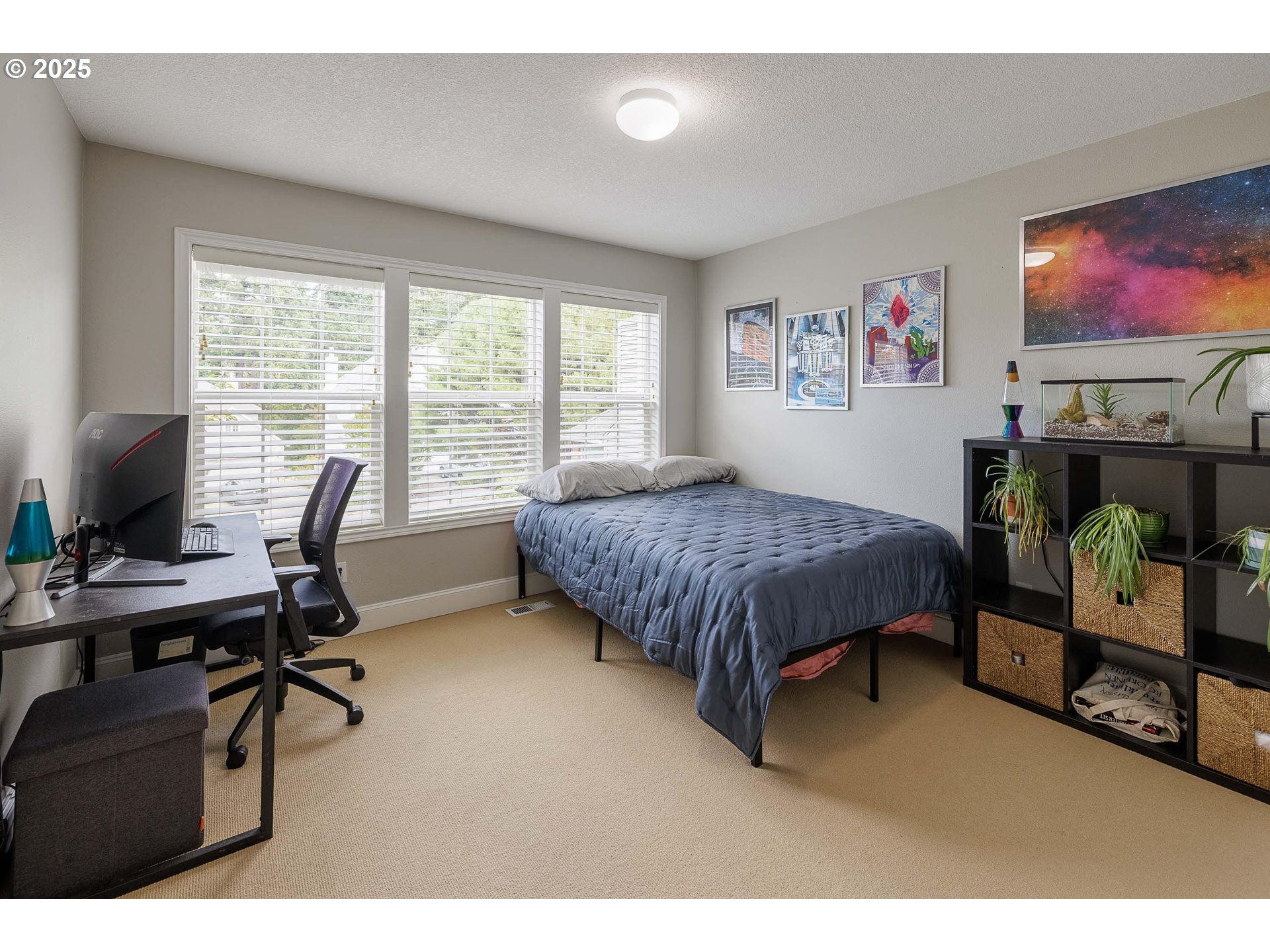 6424 Southwest Flower Street Portland, OR 97221 - Photo 18 of 29 a bedroom with furniture and a flat screen tv