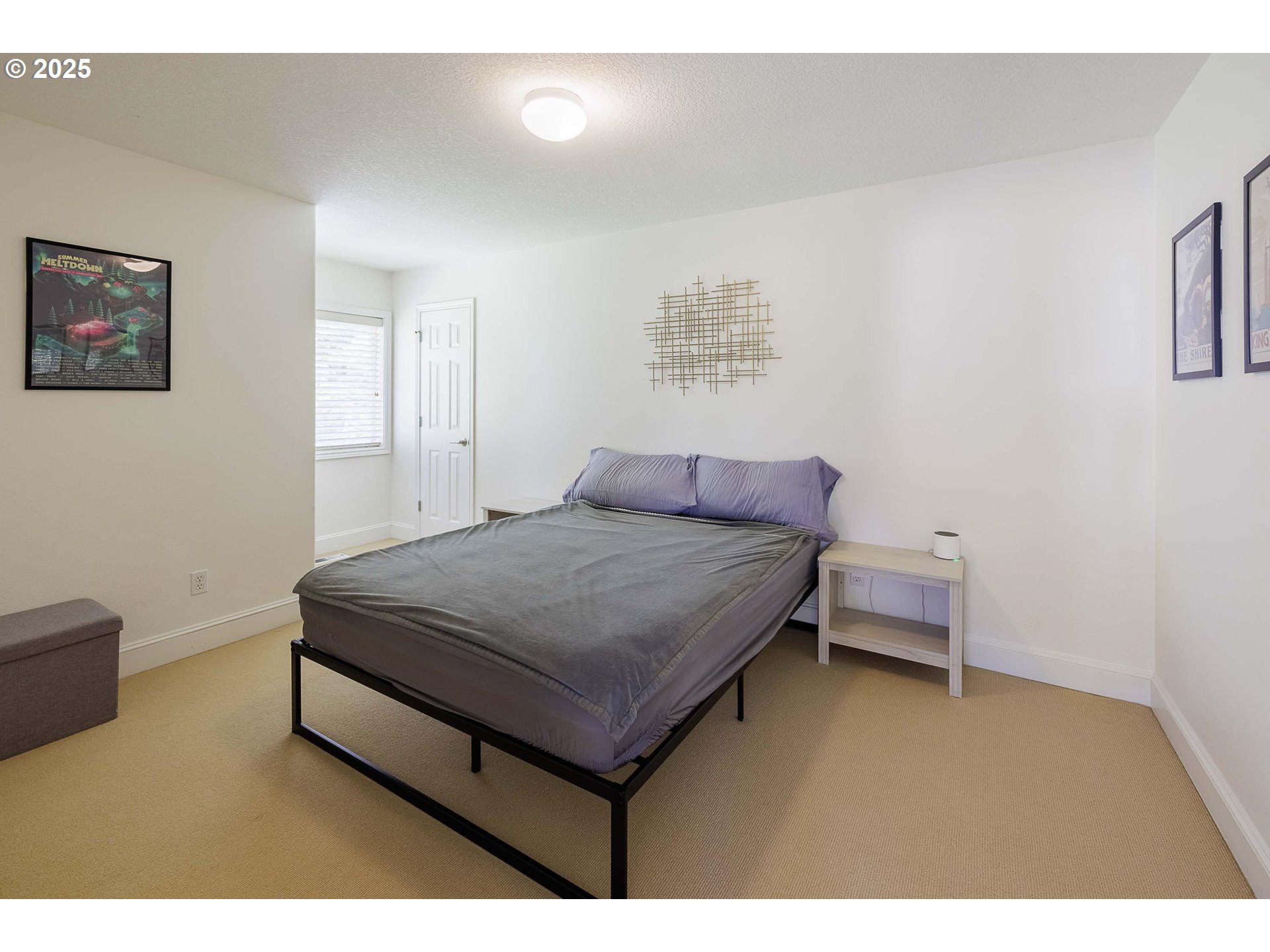 6424 Southwest Flower Street Portland, OR 97221 - Photo 20 of 29 a bedroom with a bed and a table