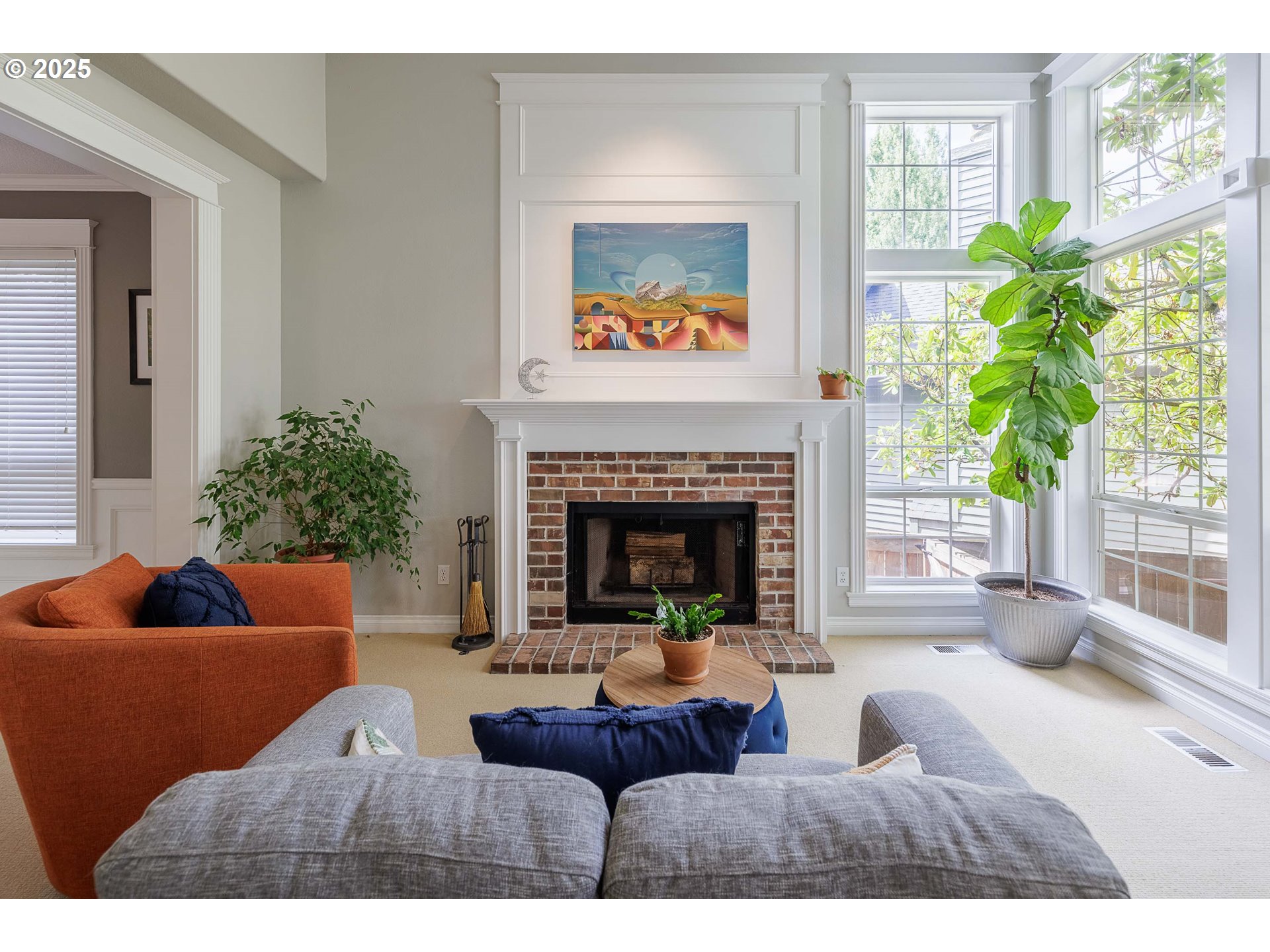 6424 Southwest Flower Street Portland, OR 97221 - Photo 2 of 29 a living room with furniture and a fireplace