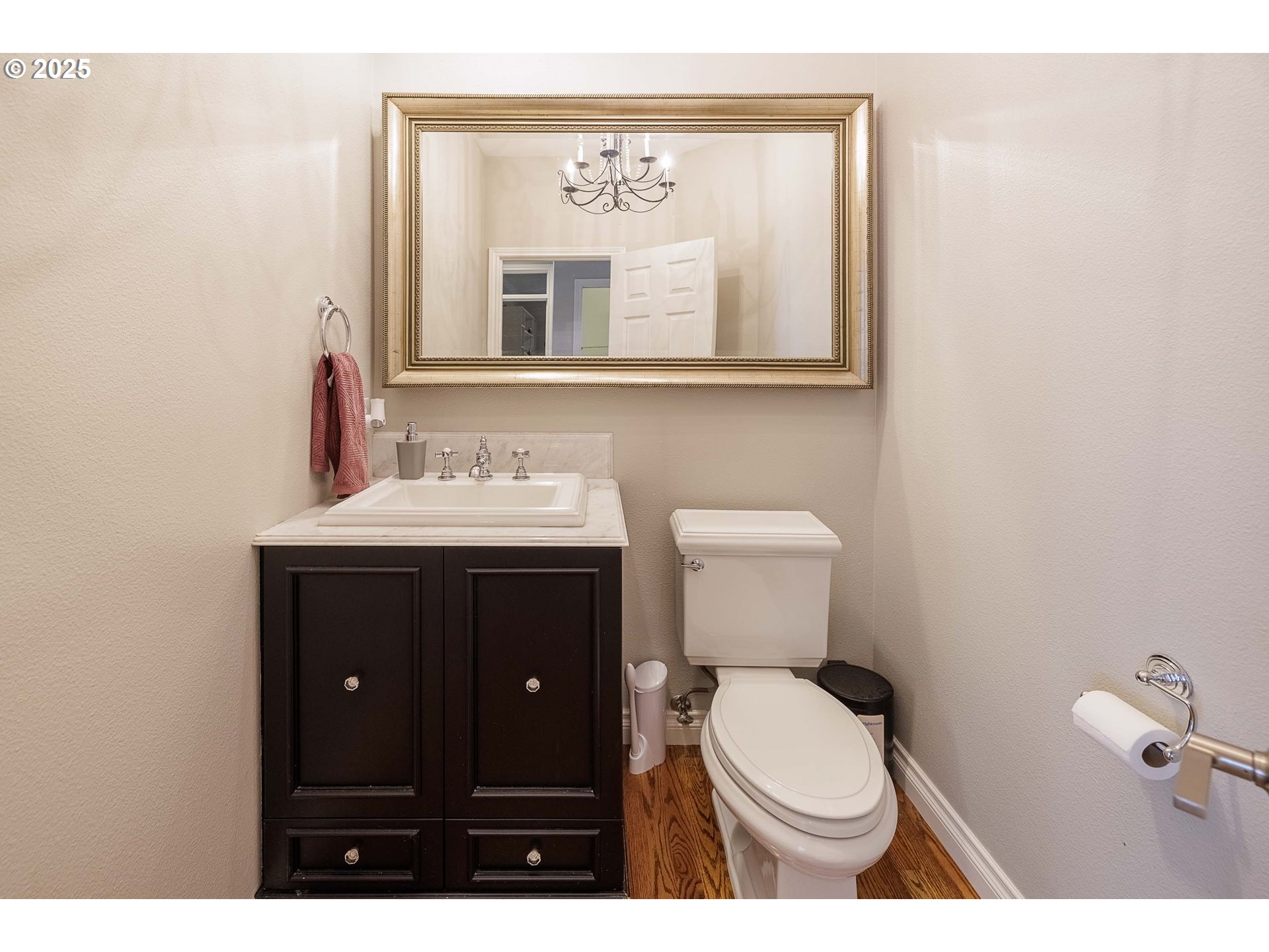 6424 Southwest Flower Street Portland, OR 97221 - Photo 22 of 29 a bathroom with a toilet sink vanity and mirror