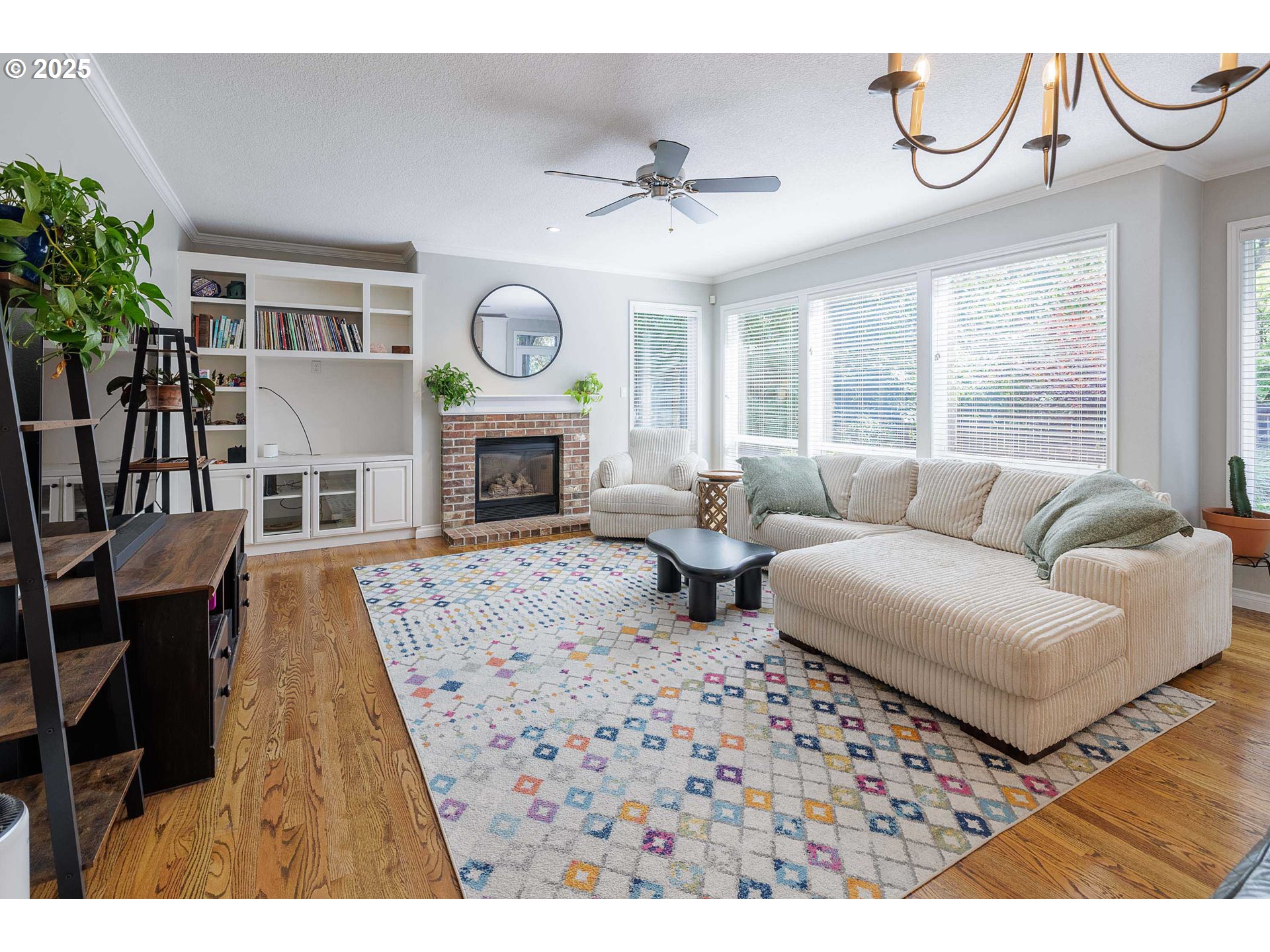 6424 Southwest Flower Street Portland, OR 97221 - Photo 8 of 29 a living room with furniture a fireplace and a large window
