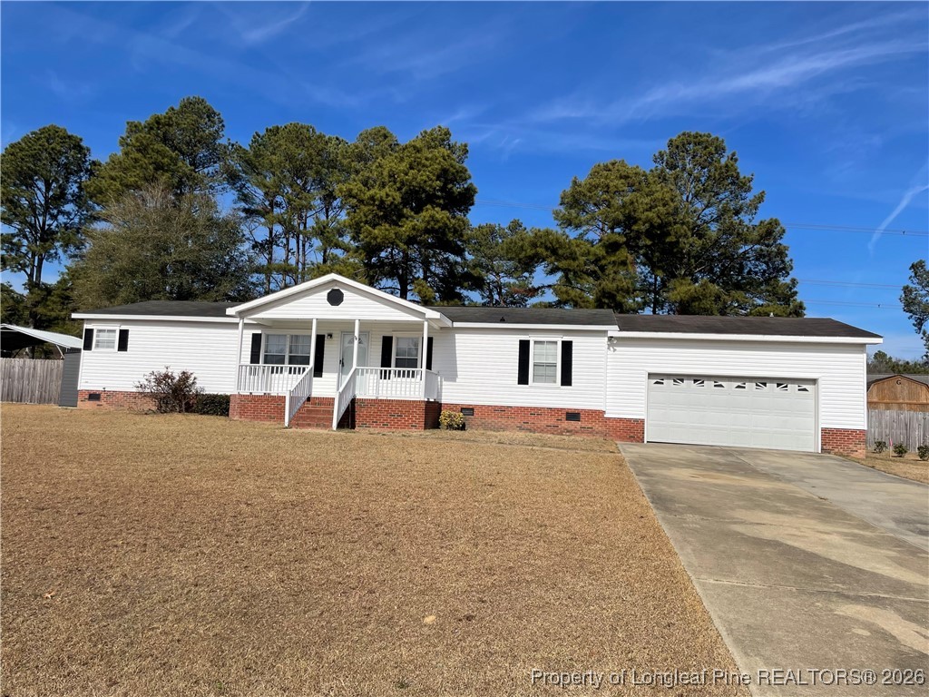 5922 Shiloah Church Road Fayetteville, NC 28306 - Photo 1 of 23 a white house that has a tree in front of it