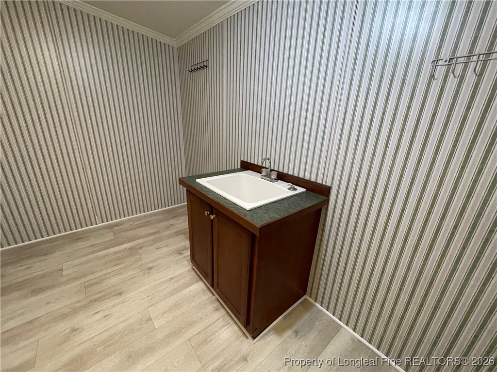 5922 Shiloah Church Road Fayetteville, NC 28306 - Photo 11 of 23 a bathroom with a sink and a mirror