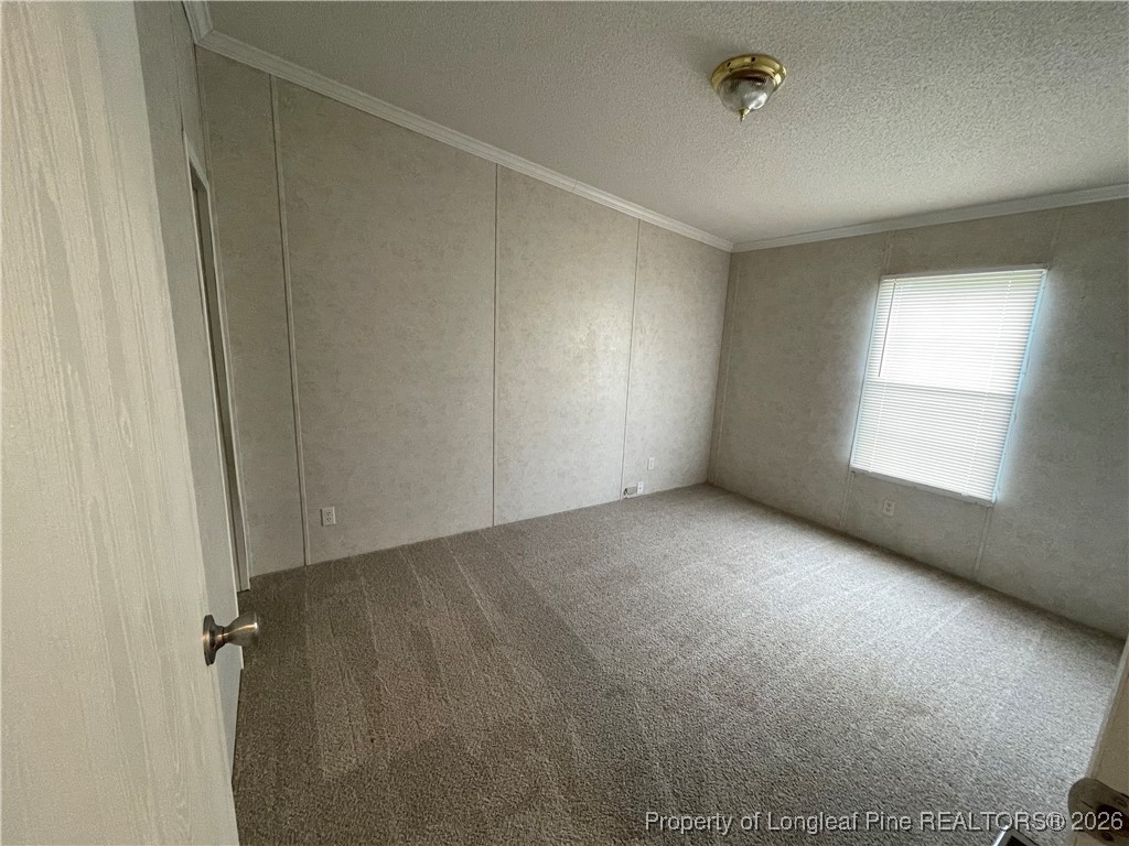 5922 Shiloah Church Road Fayetteville, NC 28306 - Photo 12 of 23 a view of an empty room with a window