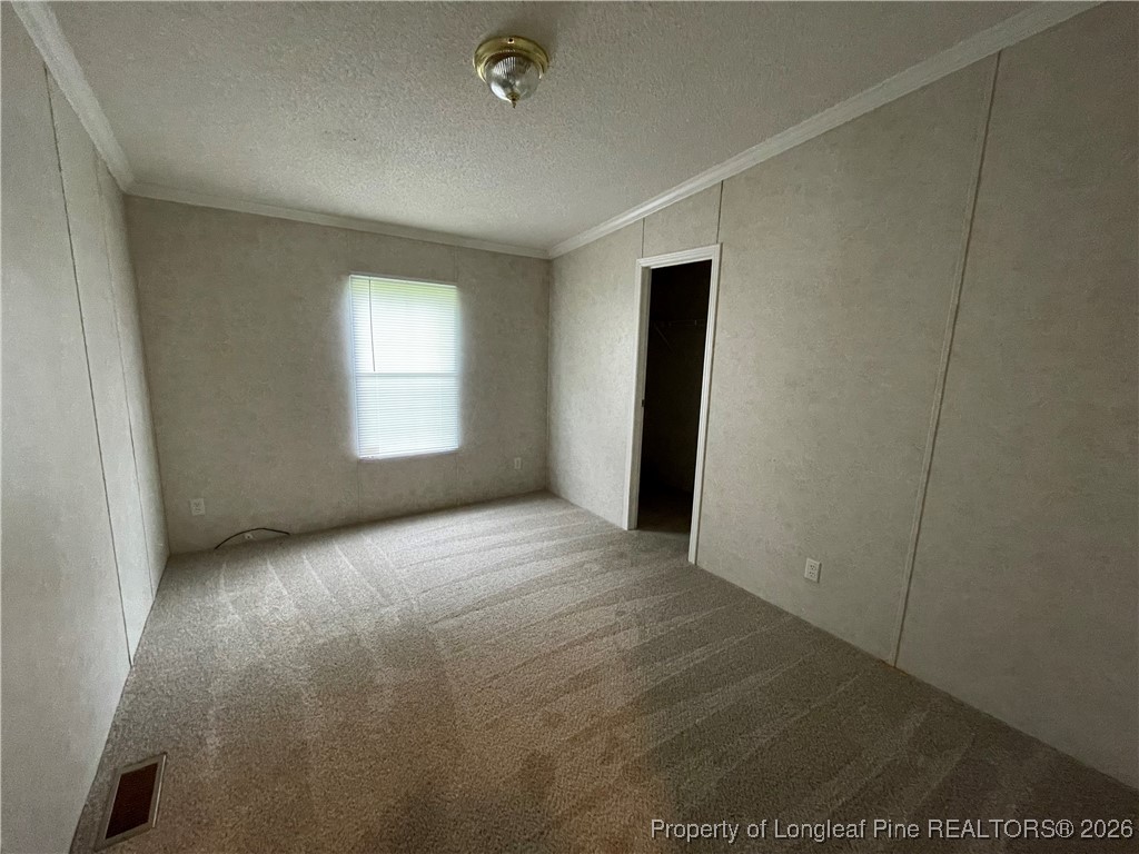 5922 Shiloah Church Road Fayetteville, NC 28306 - Photo 13 of 23 an empty room with windows