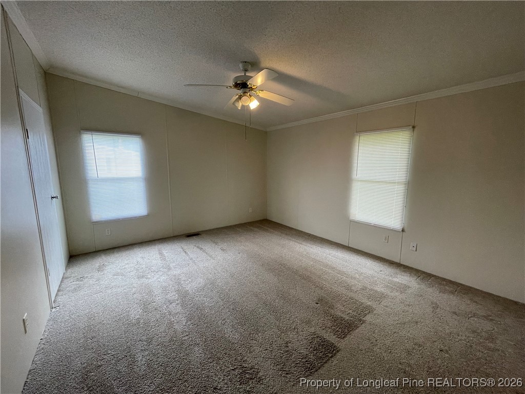 5922 Shiloah Church Road Fayetteville, NC 28306 - Photo 15 of 23 an empty room with a empty space and windows