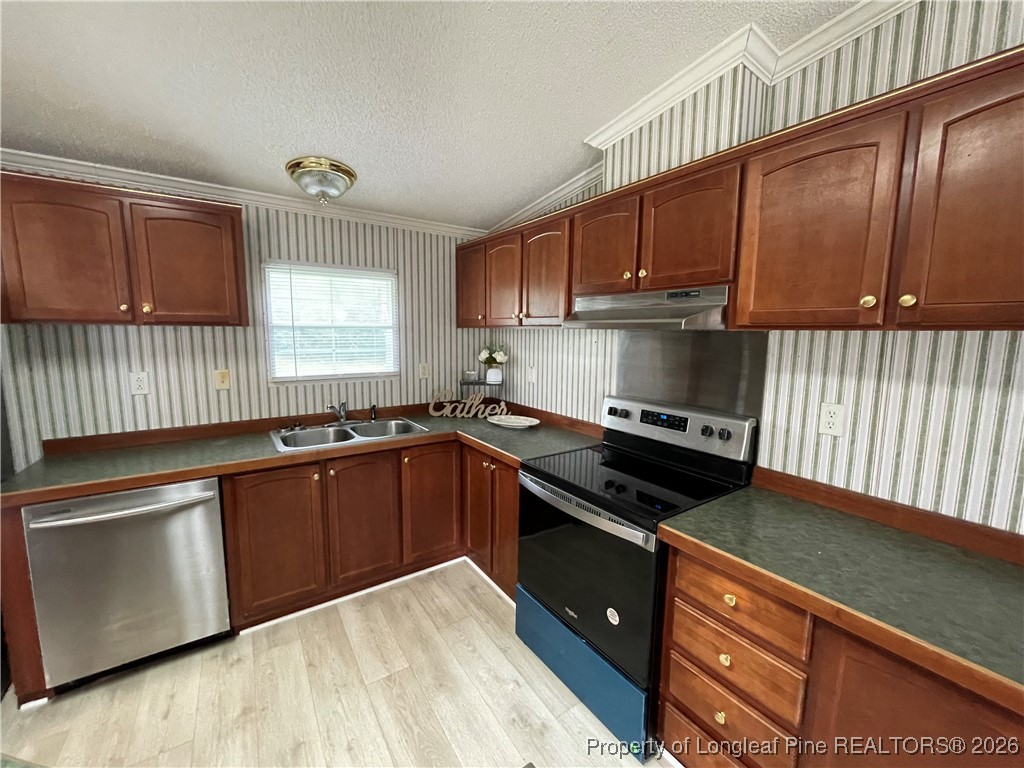 5922 Shiloah Church Road Fayetteville, NC 28306 - Photo 6 of 23 a kitchen with granite countertop wood cabinets stainless steel appliances and a window