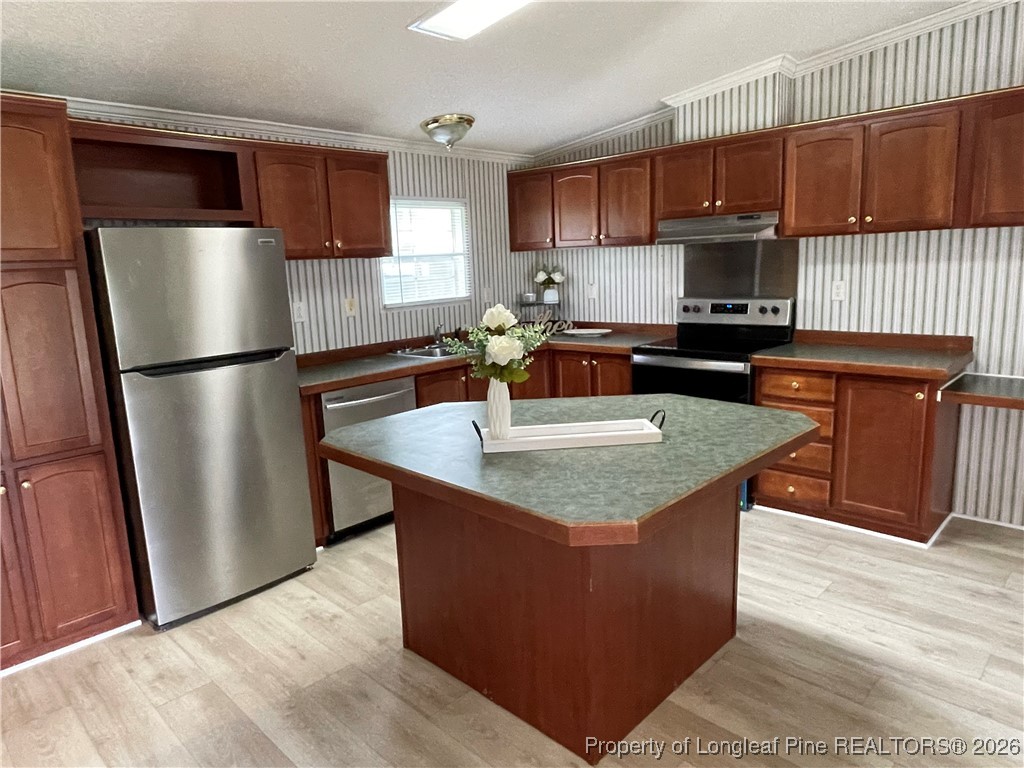 5922 Shiloah Church Road Fayetteville, NC 28306 - Photo 8 of 23 a kitchen with stainless steel appliances granite countertop a refrigerator a sink a stove a microwave and wooden cabinets