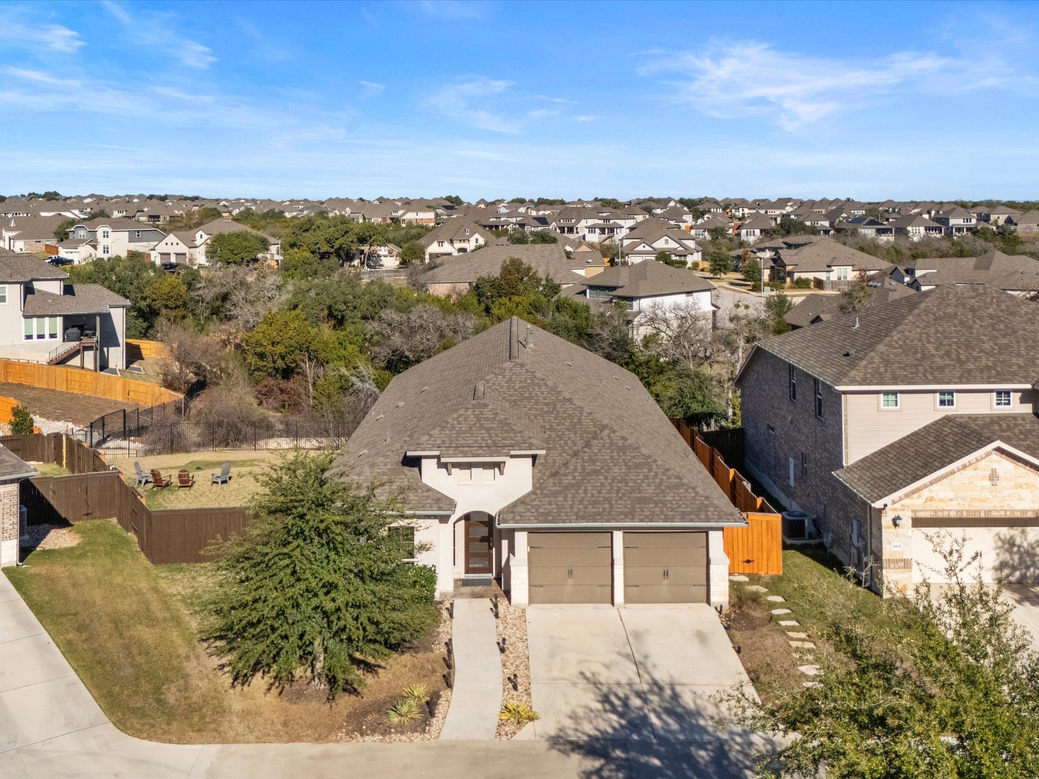 1009 Deer Rim Road Leander, TX 78641 - Photo 29 of 40 Incredible privacy with no back neighbors, no neighbors across the street, and an expansive yard space on one side of the home and tall fencing on the sides.