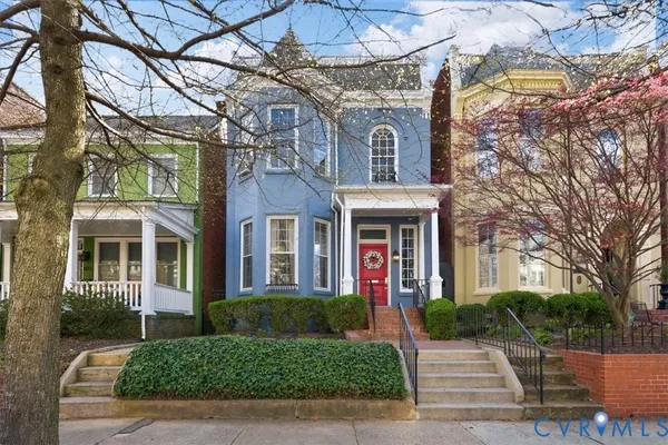 a living room with furniture fireplace and flat screen tv