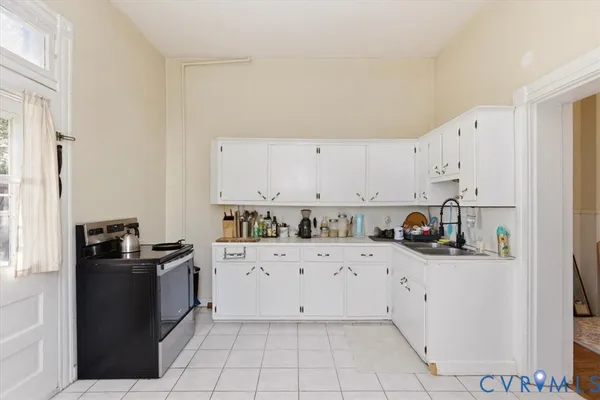 a view of a hallway with wooden floor and closet
