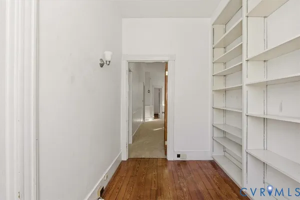 a view of a house with wooden floor and iron stairs