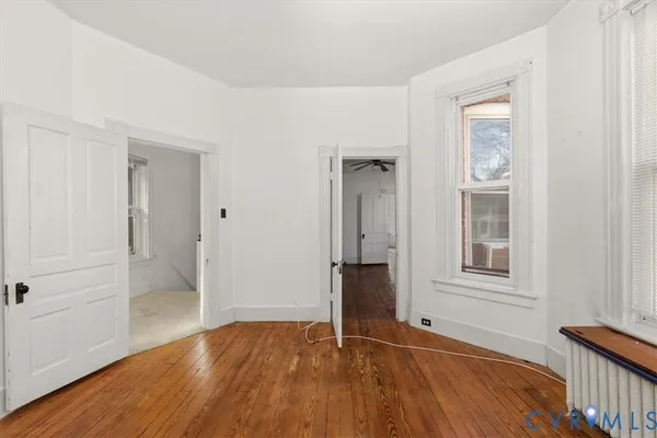 a view of walk in closet with clothes