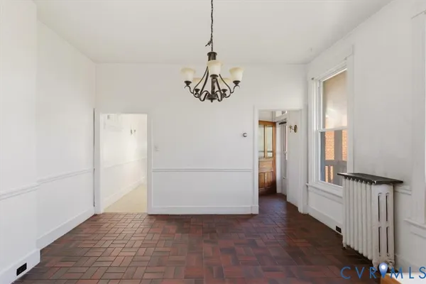 a view of balcony with wooden floor and outdoor seating
