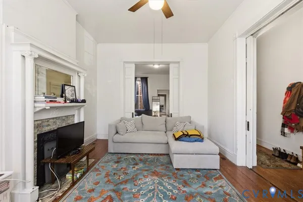a living room with furniture and a flat screen tv