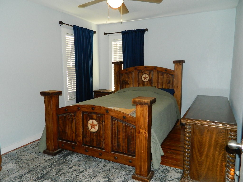 101 Maple Drive Portland, TX 78374 - Photo 6 of 11 a bed sitting in a bedroom next to a window