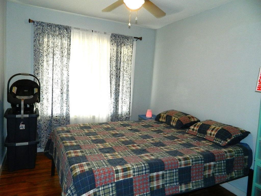 101 Maple Drive Portland, TX 78374 - Photo 7 of 11 a bedroom with a bed and a chandelier