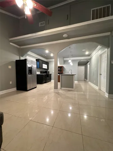 a view of a hall with furniture