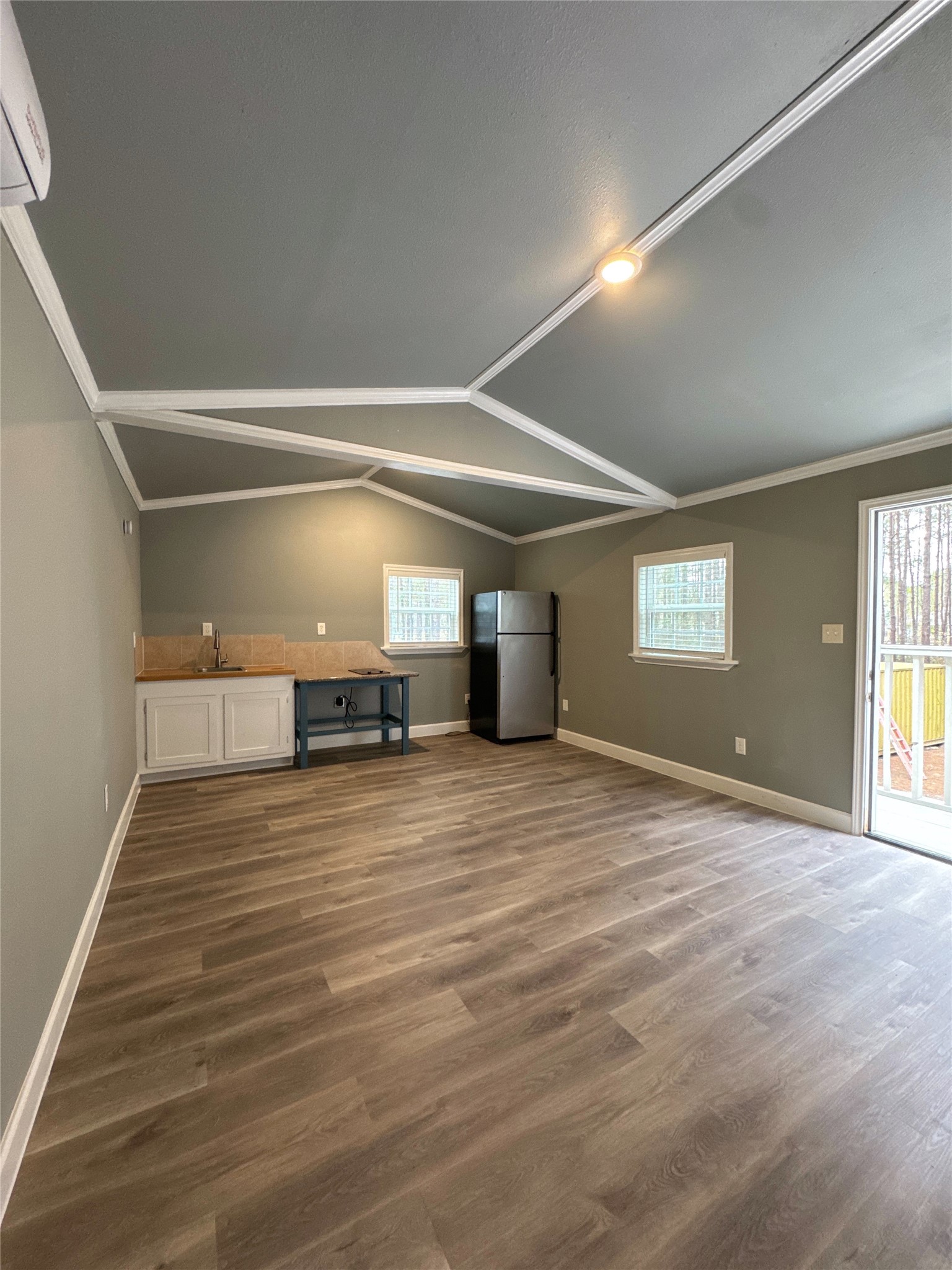 58 County Road 3560 Cleveland, TX 77327 - Photo 7 of 32 a view of empty room with wooden floor