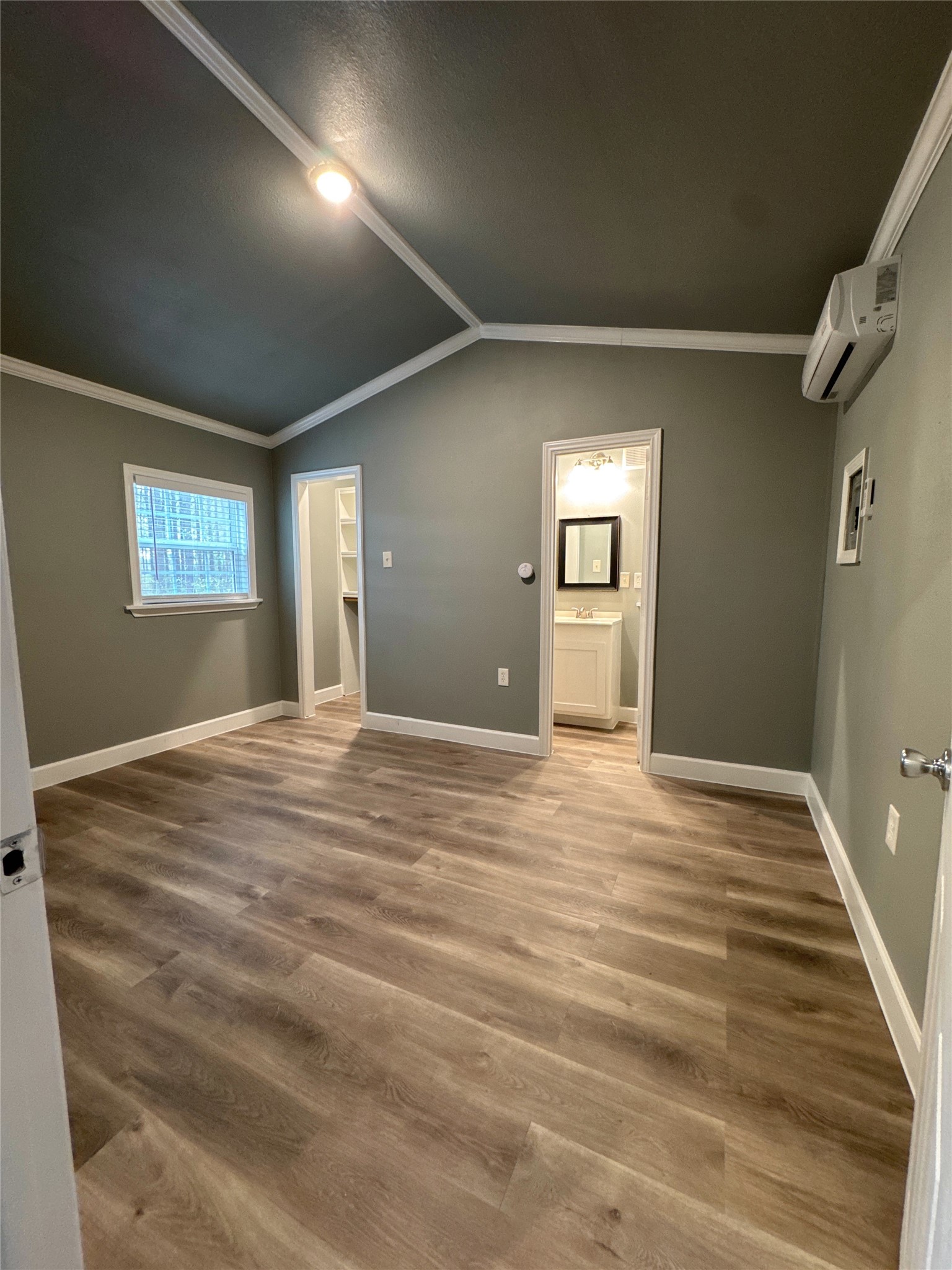 58 County Road 3560 Cleveland, TX 77327 - Photo 8 of 32 a view of a room with wooden floor and window