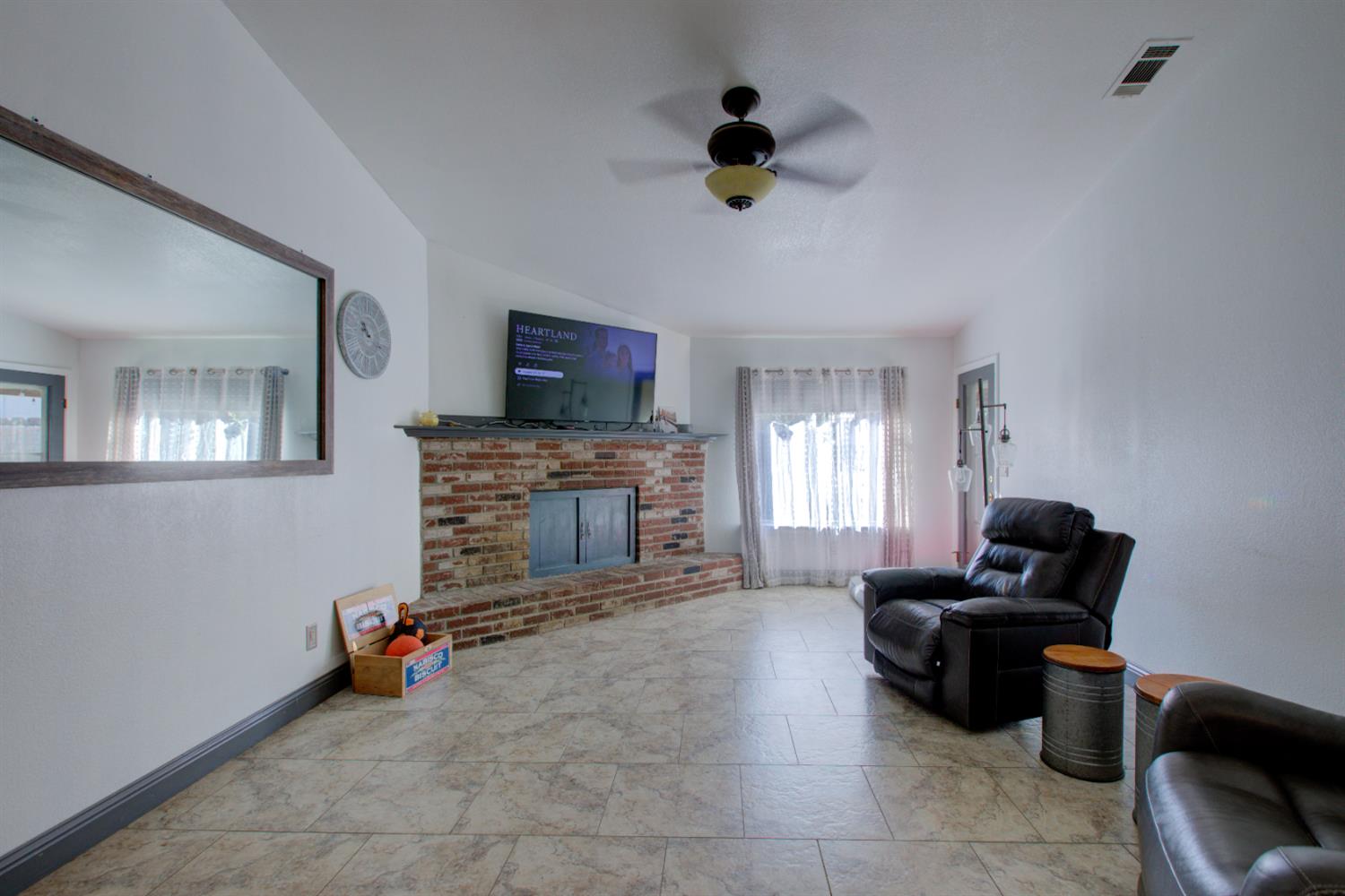 604 Kinshire Way Patterson, CA 95363 - Photo 16 of 42 a living room with furniture and a flat screen tv