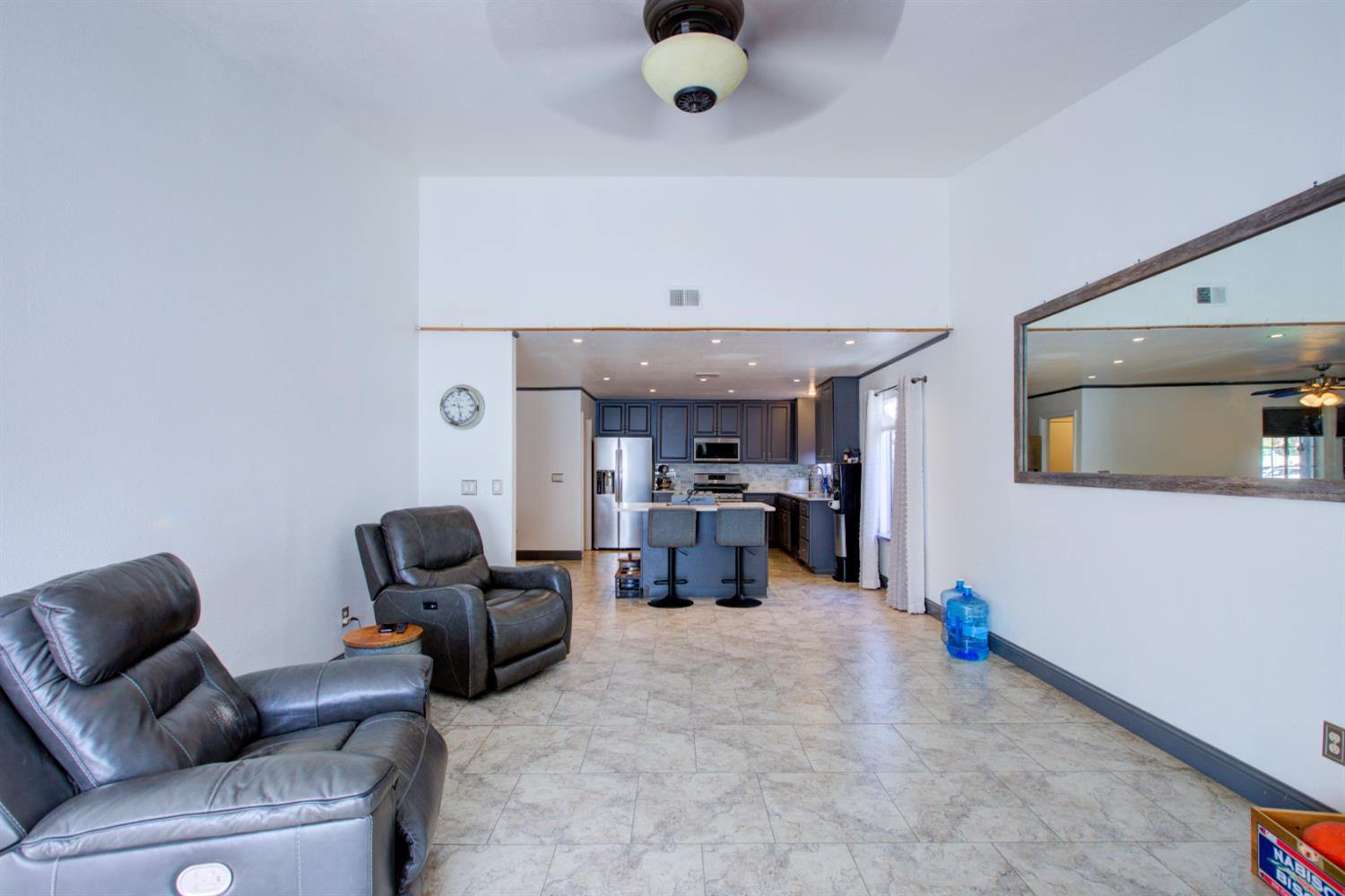 604 Kinshire Way Patterson, CA 95363 - Photo 17 of 42 a living room with furniture and a couch