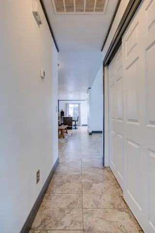 a bedroom with a bed and a closet