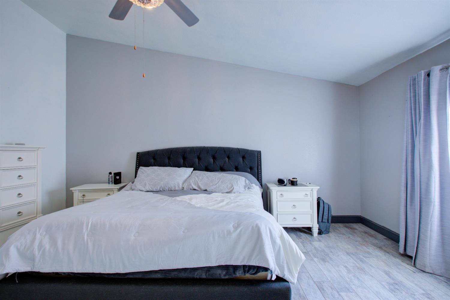 604 Kinshire Way Patterson, CA 95363 - Photo 27 of 42 a bedroom with a bed and a closet