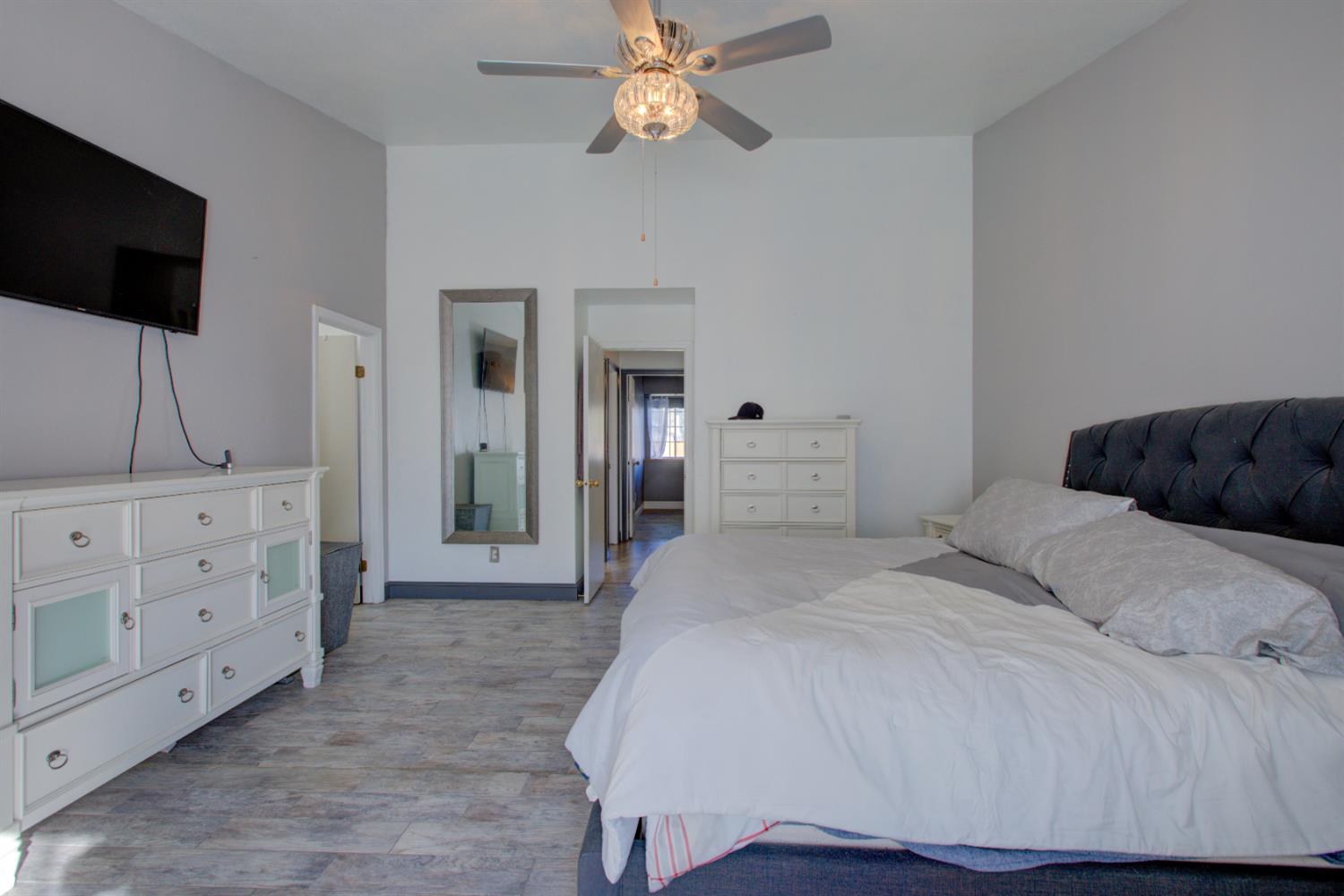 604 Kinshire Way Patterson, CA 95363 - Photo 28 of 42 a bedroom with a bed and a flat screen tv