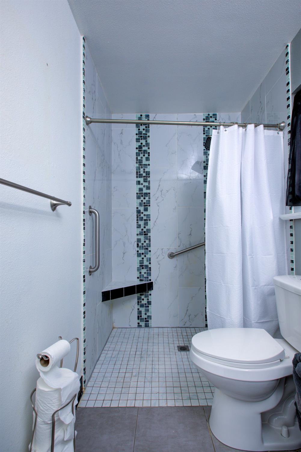 604 Kinshire Way Patterson, CA 95363 - Photo 29 of 42 a bathroom with a toilet and a shower