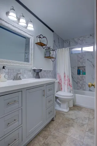a view of a kitchen with a dishwasher and cabinets