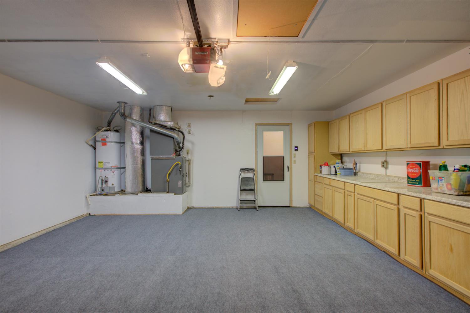 604 Kinshire Way Patterson, CA 95363 - Photo 32 of 42 a kitchen with stainless steel appliances granite countertop a sink and cabinets