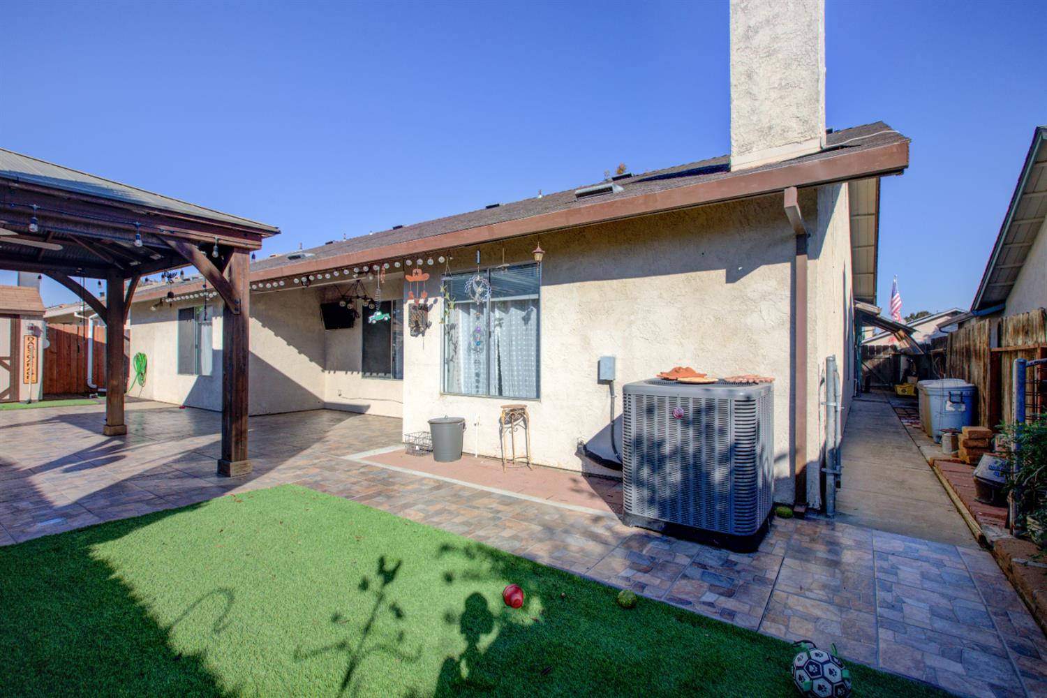 604 Kinshire Way Patterson, CA 95363 - Photo 35 of 42 a view of a house with backyard and sitting area