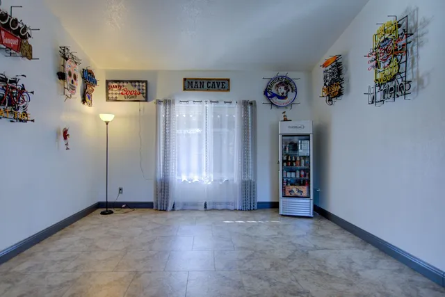 an entryway and livingroom with furniture