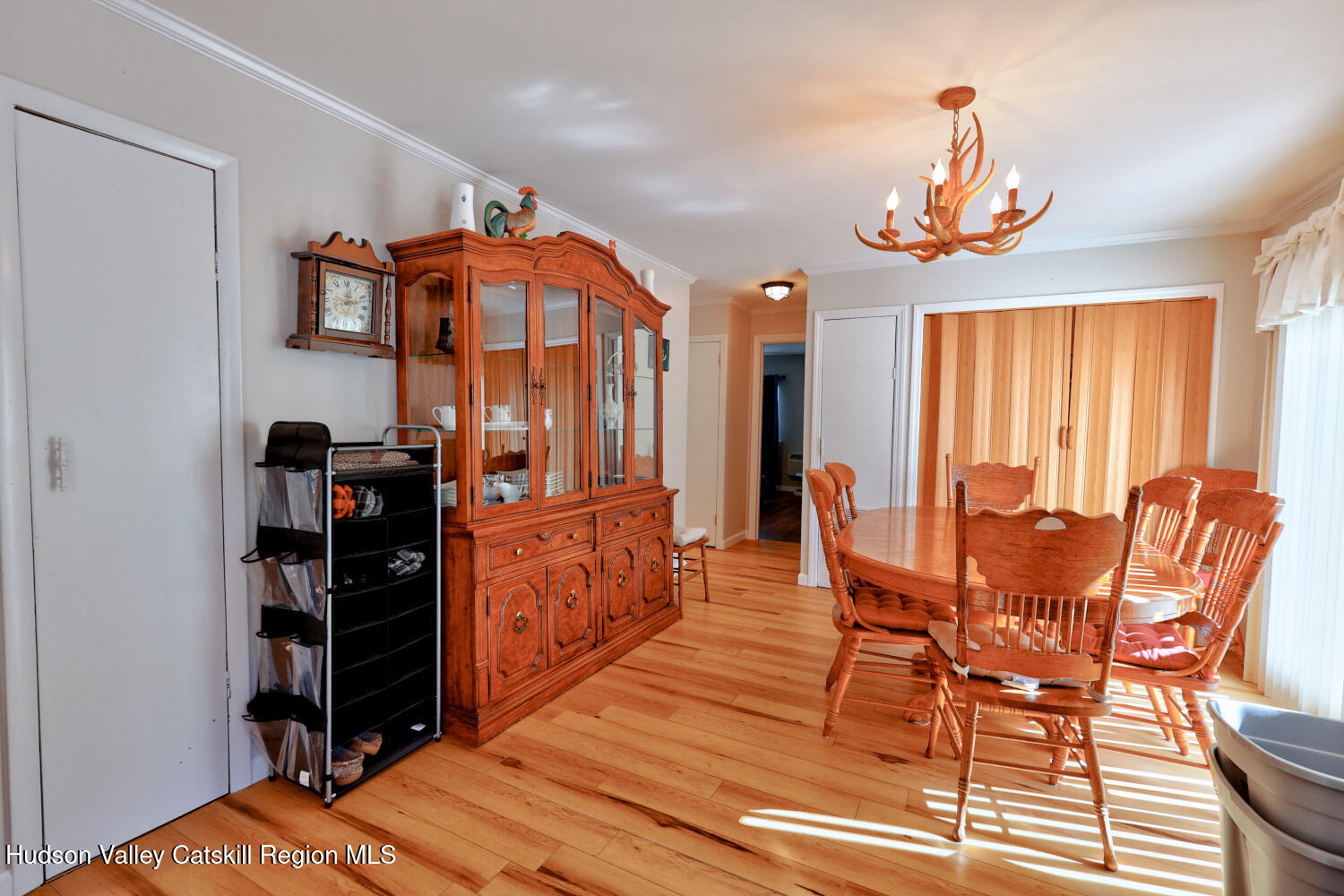 626 Bross Street Cairo, NY 12413 - Photo 18 of 78 a dining room with furniture a chandelier and wooden floor