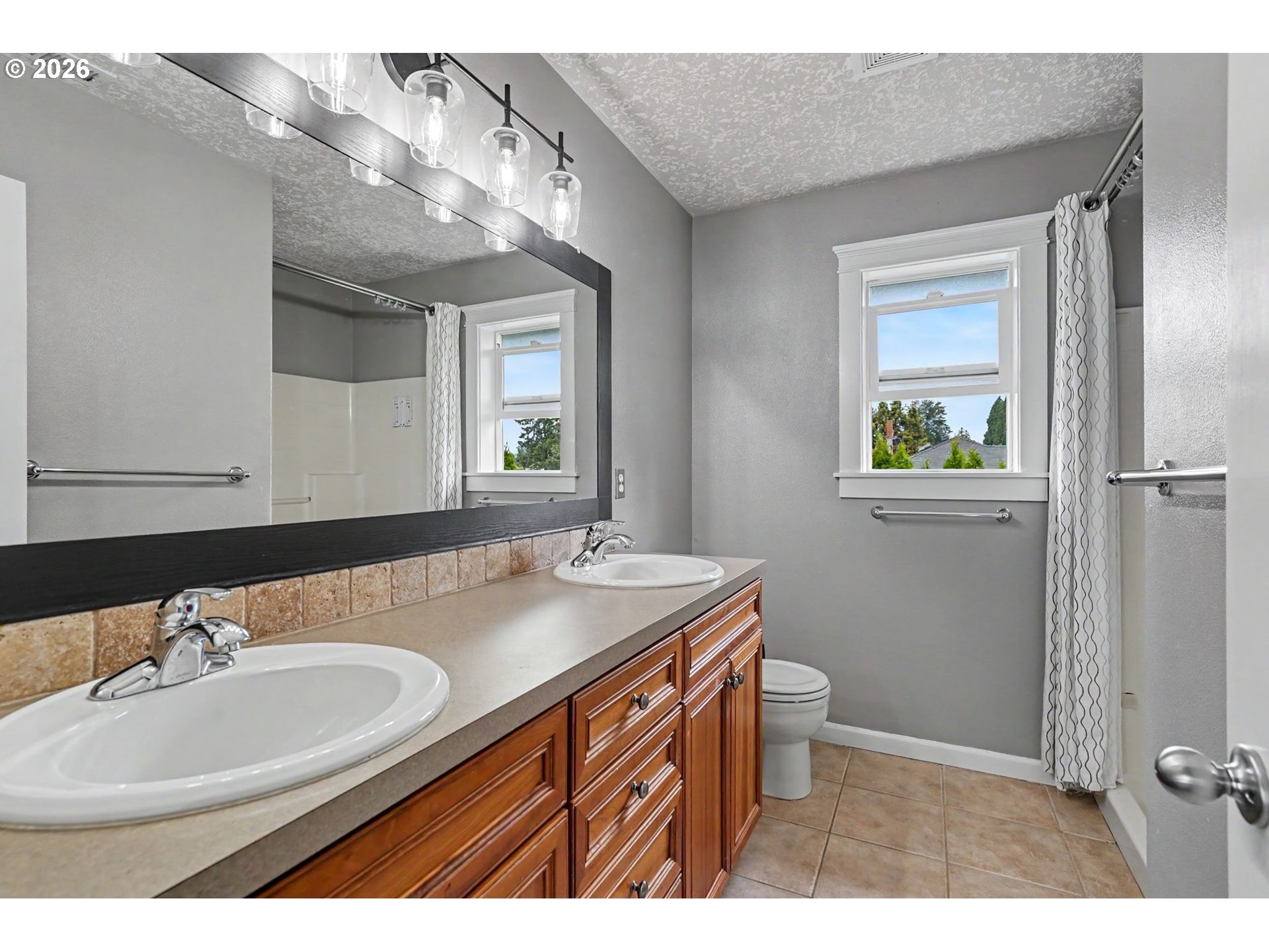 1462 Barnick Road Northeast Keizer, OR 97303 - Photo 28 of 48 a bathroom with a sink a toilet and a mirror