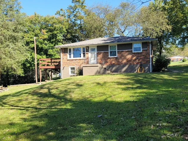 a view of a house with a yard patio and a patio