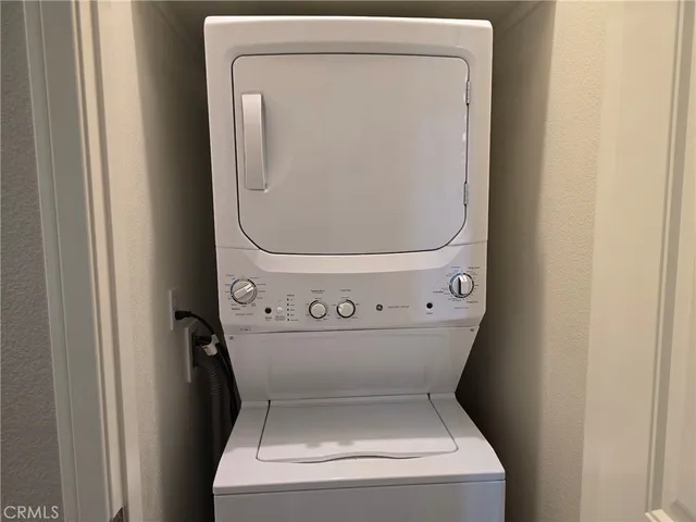 a view of a patio with a table and chairs
