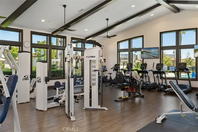 a living room with fireplace furniture and a large window