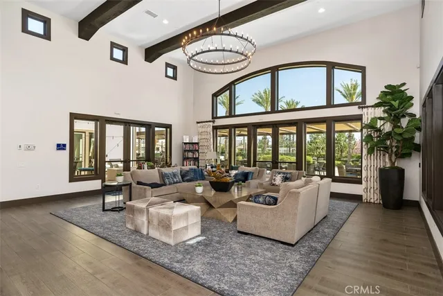 a view of a patio with a table and chairs under an umbrella