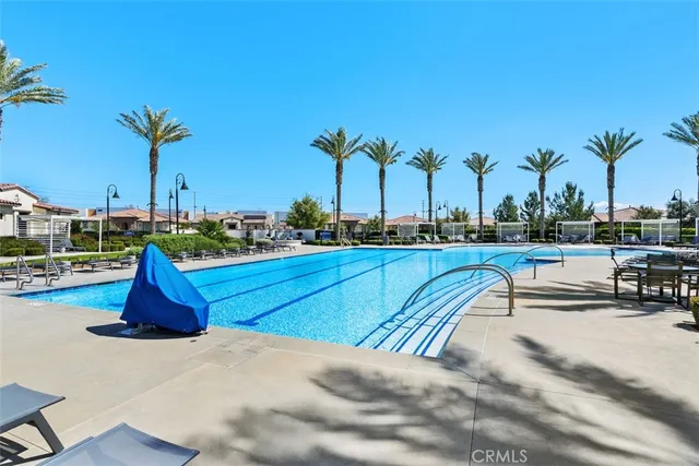 a view of a swimming pool with a lake view