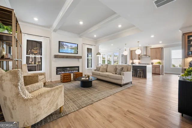 a living room with furniture and a potted plant