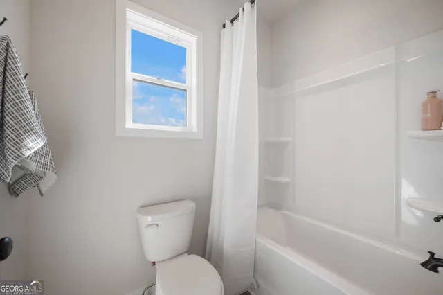 a view of a house with swimming pool and a yard