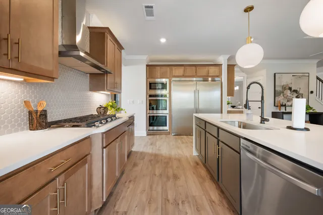 a bathroom with a double vanity sink mirror and shower